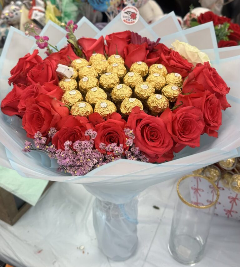 Graduation bouquet with red roses and Ferrero Rocher chocolates created by a florist in Rochester.